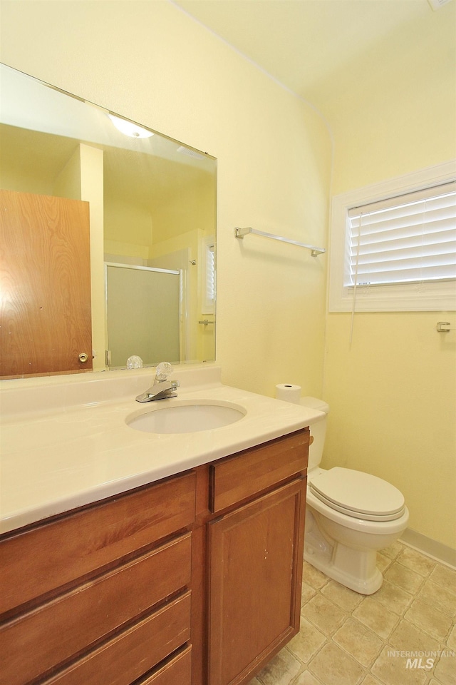 full bath with toilet, a shower stall, and vanity