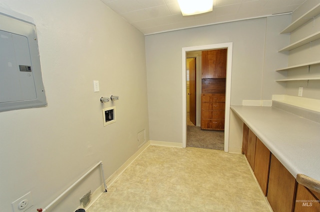 laundry area featuring hookup for a gas dryer, laundry area, electric panel, and baseboards