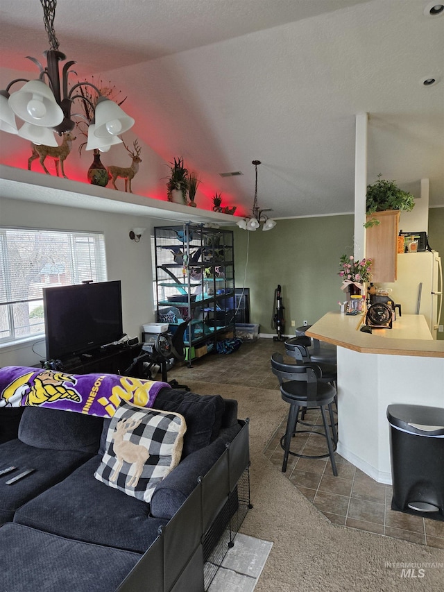 living room featuring carpet flooring, vaulted ceiling, and visible vents