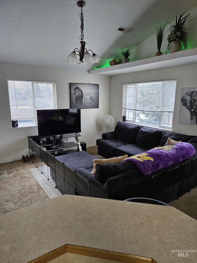 living room featuring carpet floors, plenty of natural light, and lofted ceiling