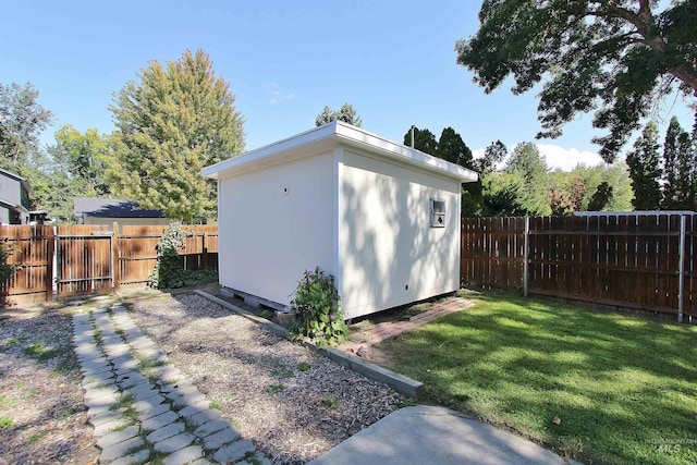 view of shed with a fenced backyard