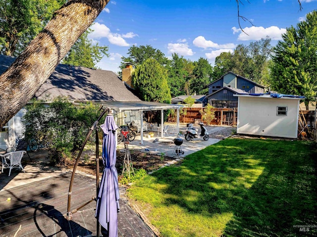 view of yard featuring a patio and fence