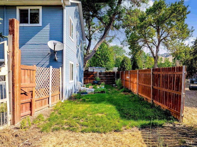 view of yard with a fenced backyard