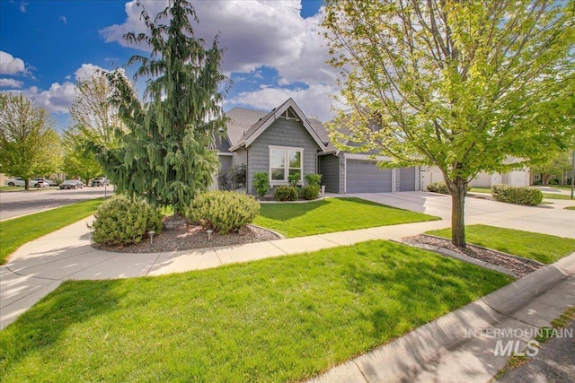 5726 N Morpheus Way, Meridian, ID 83642 - view of front of home with concrete driveway, a front yard, and an attached garage