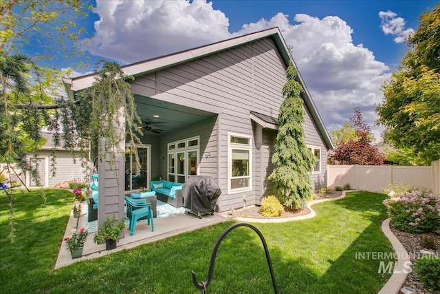 5726 N Morpheus Way, Meridian, ID 83642 - rear view of house featuring ceiling fan, an outdoor living space, and a patio
