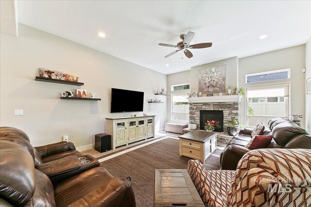 5726 N Morpheus Way, Meridian, ID 83642 - living room with ceiling fan, baseboards, carpet floors, a stone fireplace, and recessed lighting
