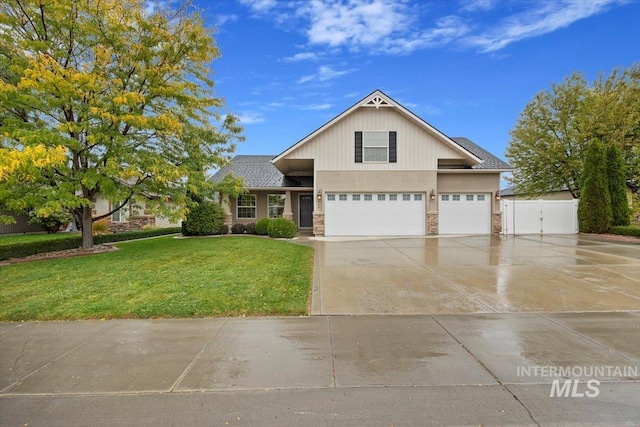 view of front facade with a front yard and a garage