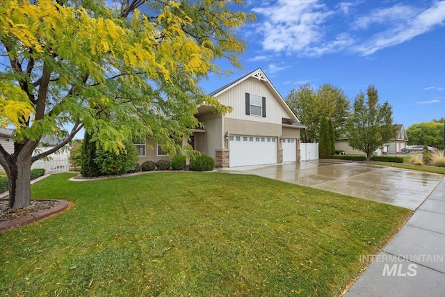 view of front facade with a front yard and a garage