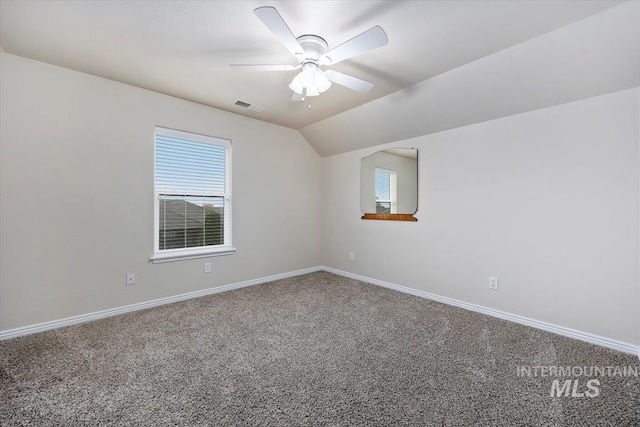 additional living space featuring lofted ceiling, carpet flooring, and ceiling fan