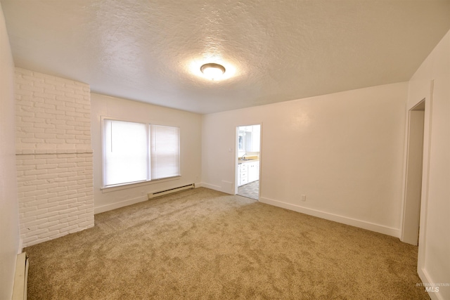 carpeted spare room featuring a textured ceiling and a baseboard radiator