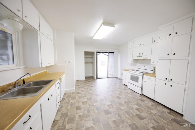 kitchen with white cabinetry, white appliances, and sink