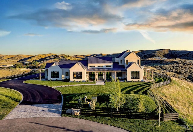 12900 N Brahman Ln, Boise, ID 83714 - modern inspired farmhouse with a standing seam roof, a mountain view, metal roof, and driveway