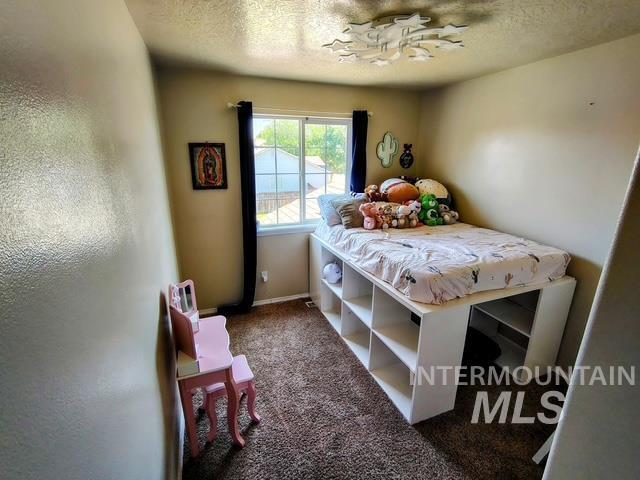 2150 W Shy Crk, Nampa, ID 83686 - carpeted bedroom with a textured ceiling