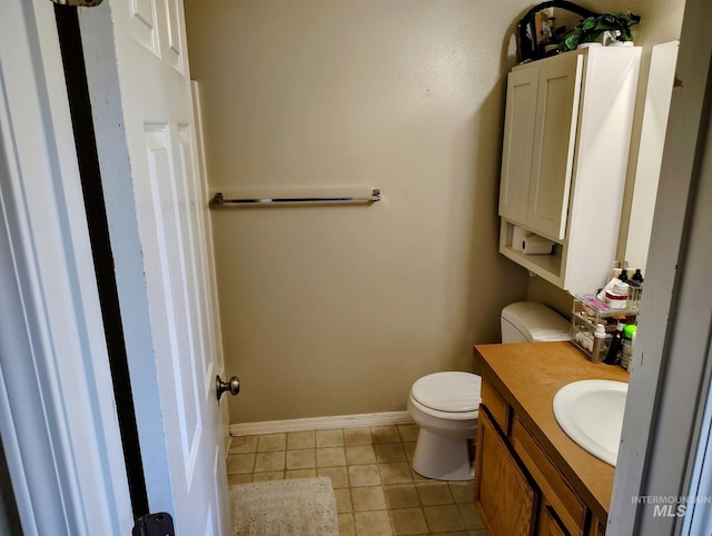 2150 W Shy Crk, Nampa, ID 83686 - half bath with toilet, tile patterned floors, vanity, and baseboards