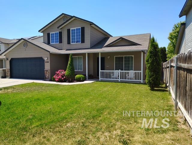 2150 W Shy Crk, Nampa, ID 83686 - view of front of home with covered porch, an attached garage, and concrete driveway