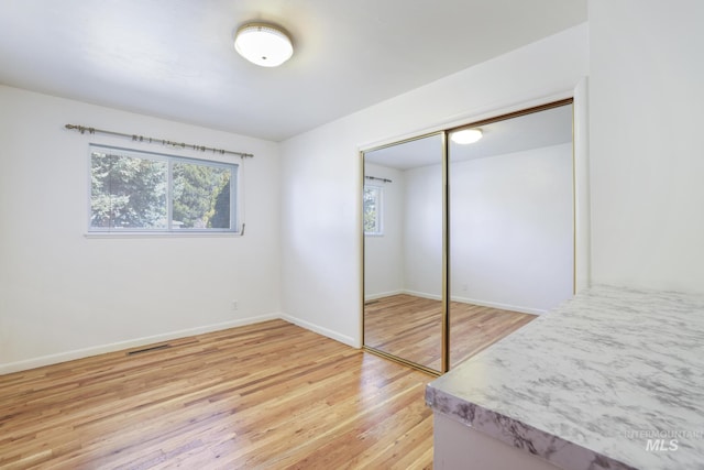 2144 Crestwood Dr, Twin Falls, ID 83301 - unfurnished bedroom featuring light wood finished floors, a closet, and baseboards