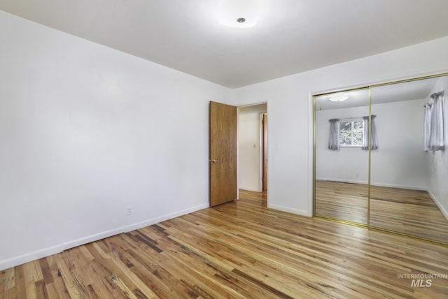 2144 Crestwood Dr, Twin Falls, ID 83301 - unfurnished bedroom with wood finished floors, baseboards, and a closet