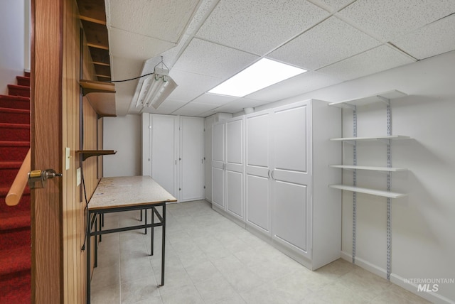 2144 Crestwood Dr, Twin Falls, ID 83301 - finished basement featuring a paneled ceiling, stairs, and baseboards