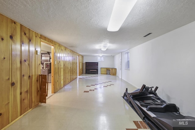 2144 Crestwood Dr, Twin Falls, ID 83301 - below grade area featuring wood walls and a textured ceiling