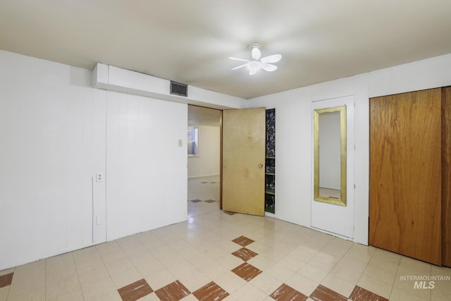 2144 Crestwood Dr, Twin Falls, ID 83301 - unfurnished bedroom featuring tile patterned floors, a ceiling fan, and two closets