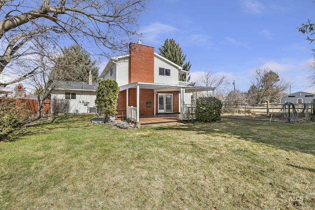 2144 Crestwood Dr, Twin Falls, ID 83301 - rear view of house with brick siding, a chimney, and a wooden deck
