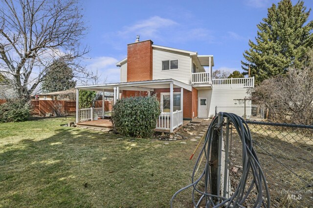 2144 Crestwood Dr, Twin Falls, ID 83301 - back of house featuring a chimney, brick siding, and a balcony