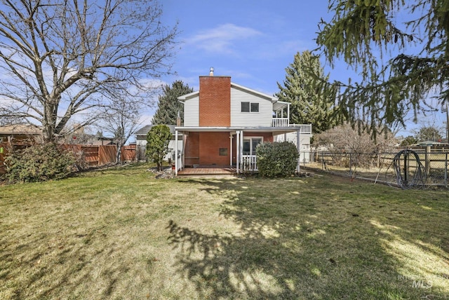2144 Crestwood Dr, Twin Falls, ID 83301 - back of house featuring a chimney, brick siding, and a balcony
