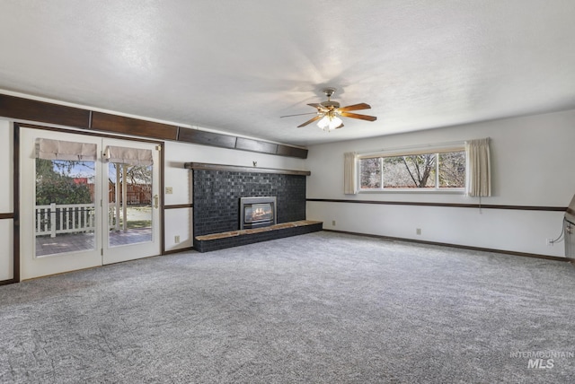 2144 Crestwood Dr, Twin Falls, ID 83301 - unfurnished living room featuring carpet, ceiling fan, a brick fireplace, and baseboards