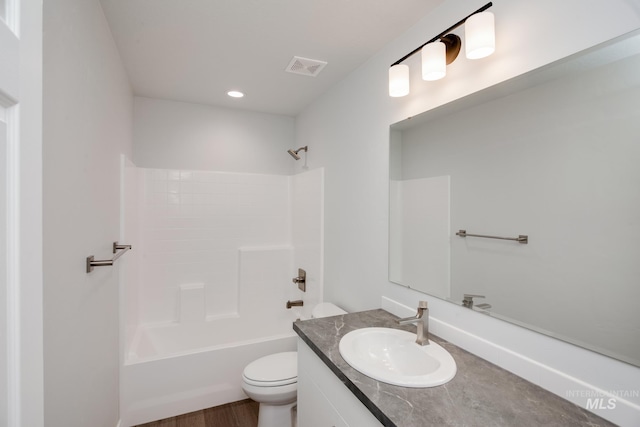 5814 W Mikonos St, Meridian, ID 83646 - bathroom with washtub / shower combination, vanity, visible vents, and toilet