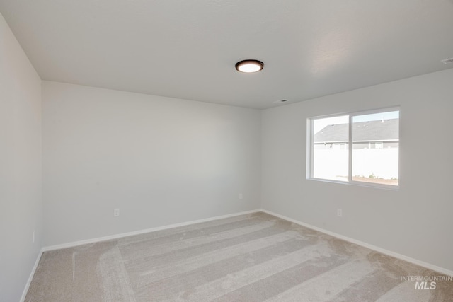 5814 W Mikonos St, Meridian, ID 83646 - unfurnished room with light carpet, visible vents, and baseboards