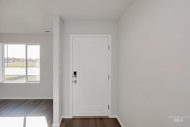 5814 W Mikonos St, Meridian, ID 83646 - foyer featuring dark wood-type flooring, visible vents, and baseboards
