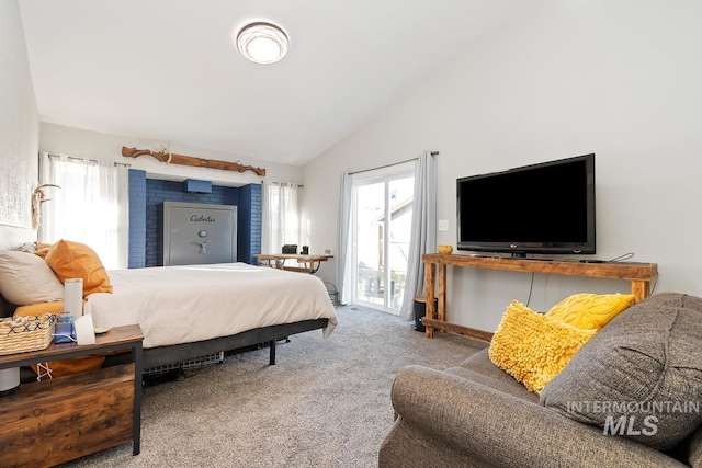 carpeted bedroom with lofted ceiling and access to outside