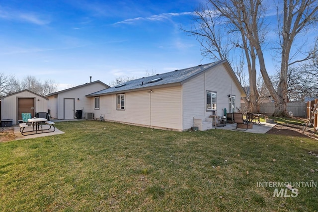 rear view of house with a yard, a patio area, and cooling unit