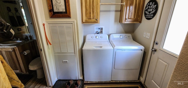 110 Memory Ln, Kamiah, ID 83536 - washroom with washing machine and clothes dryer, a sink, and a heating unit