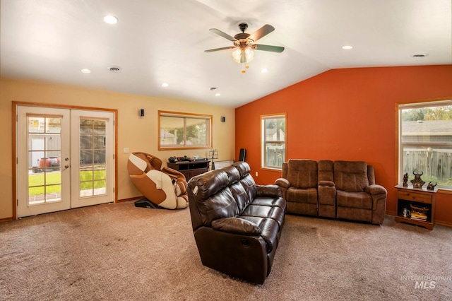 carpeted living room featuring french doors, lofted ceiling, and ceiling fan