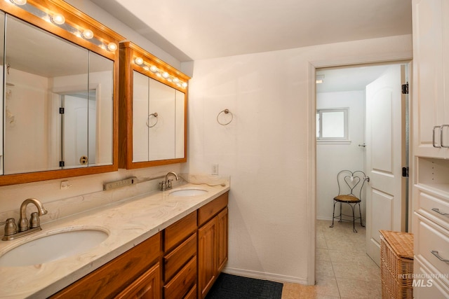 bathroom featuring tile patterned floors and vanity