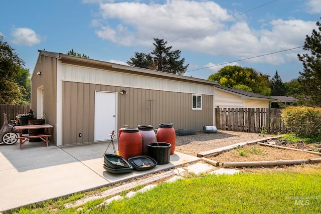 back of property with a patio