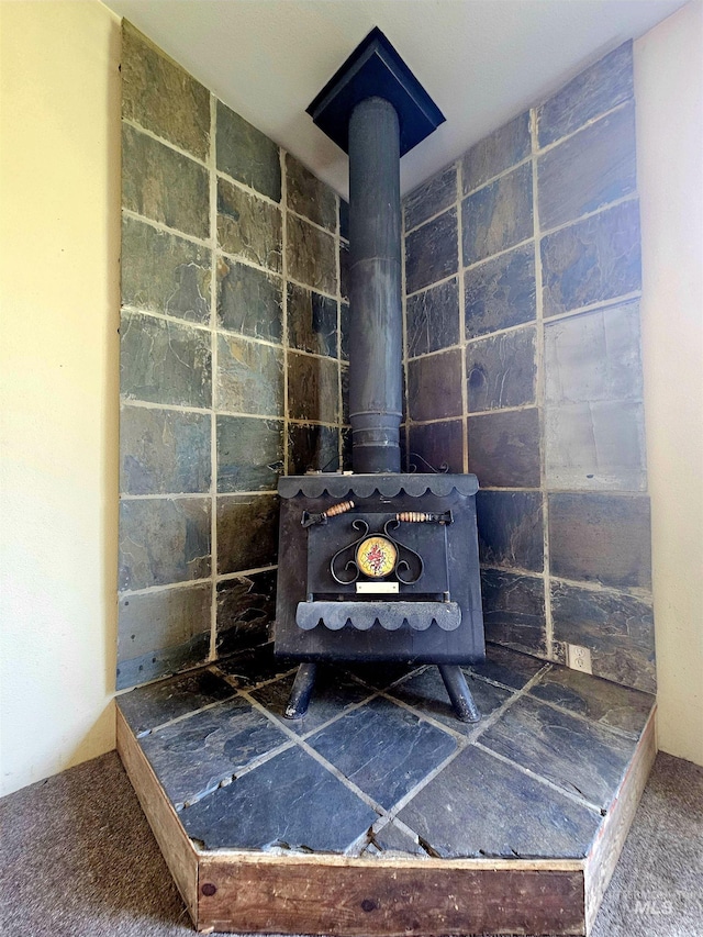 detailed view of a wood stove and carpet flooring