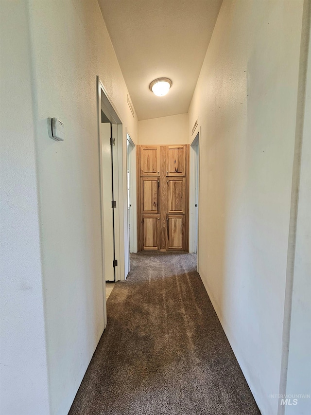 corridor featuring carpet flooring
