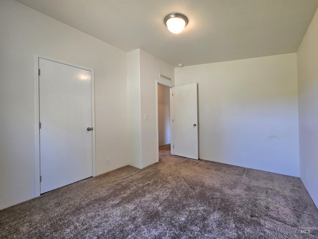 unfurnished bedroom with carpet