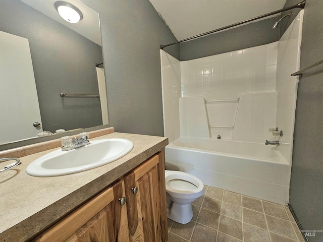 bathroom featuring toilet, bathtub / shower combination, vanity, and tile patterned flooring