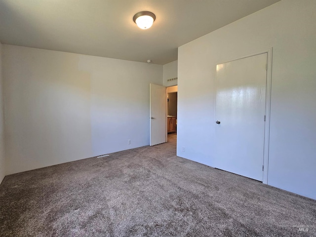 unfurnished bedroom with carpet floors