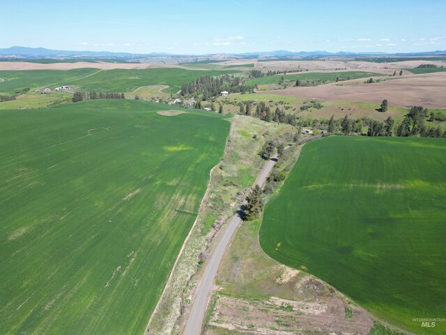 aerial overview of property's location featuring a mountain backdrop