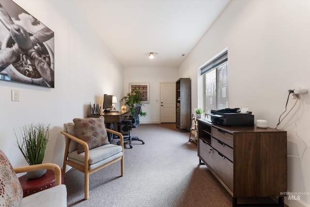 carpeted office space with baseboards