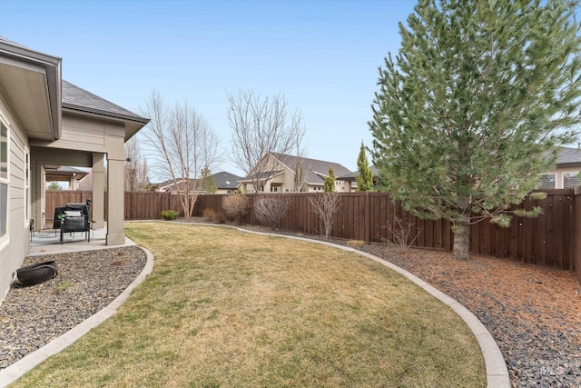 view of yard featuring a patio and a fenced backyard