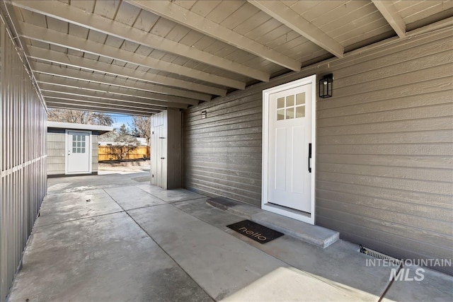 entrance to property featuring a patio