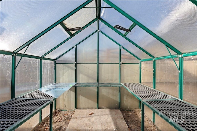 view of patio featuring an outbuilding