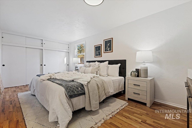 bedroom featuring light hardwood / wood-style flooring and a closet