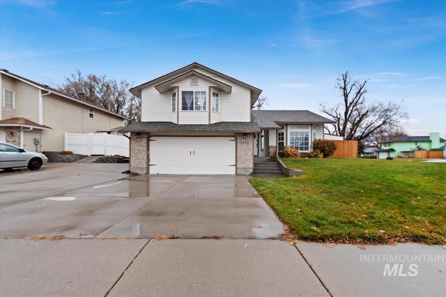 view of front of home with a garage and a front lawn