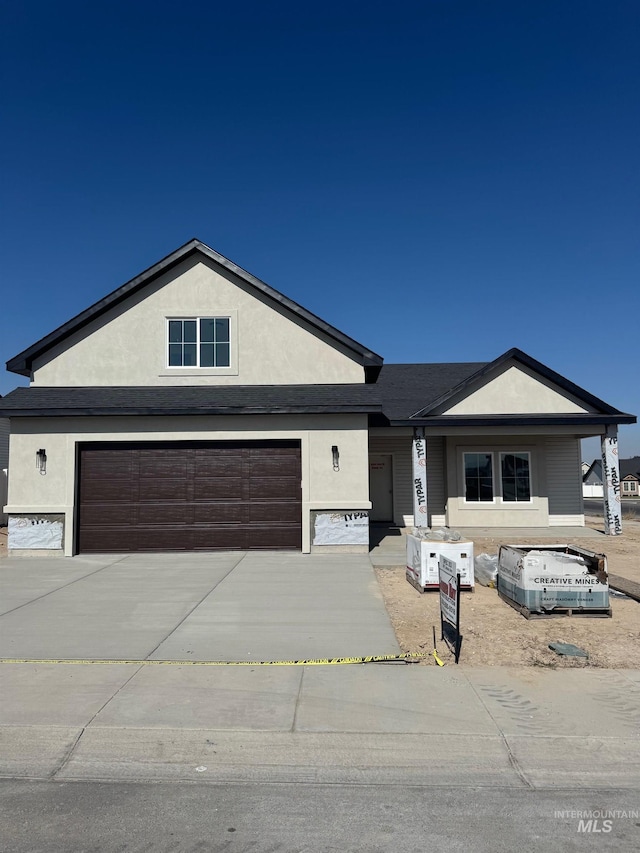 ranch-style house featuring a garage